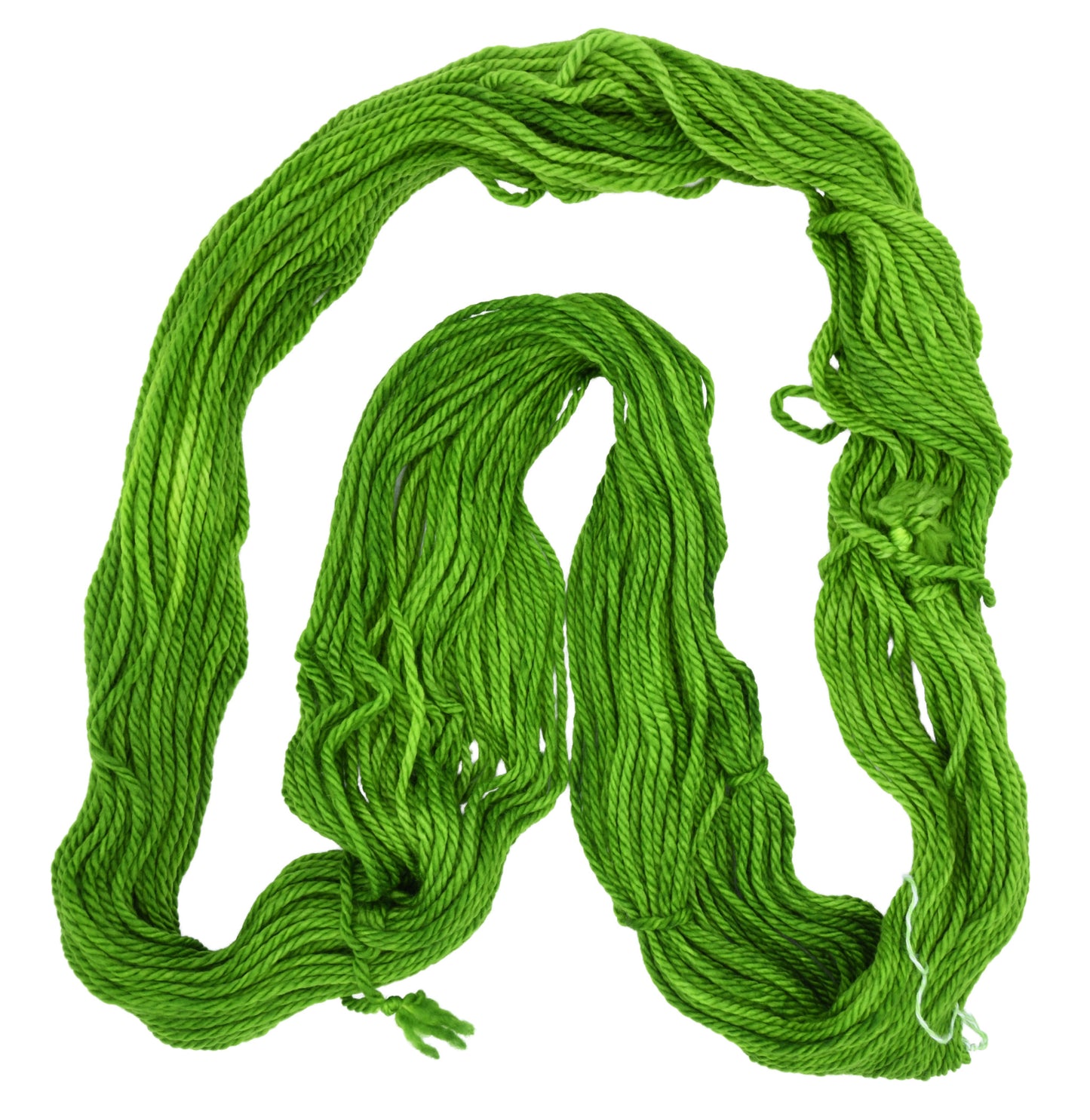 An unfolded skein of Barn Yarn hand-dyed bulky weight yarn in colorway Envy - a vibrant avocado green shade, perfect for bold knitting and crochet projects.