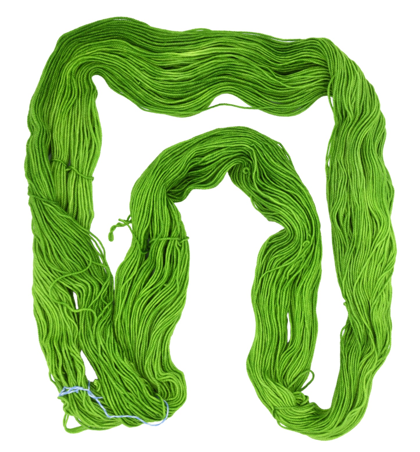 An unfolded skein of Barn Yarn hand-dyed sport weight yarn in colorway Envy - a vibrant avocado green shade, perfect for bold knitting and crochet projects.