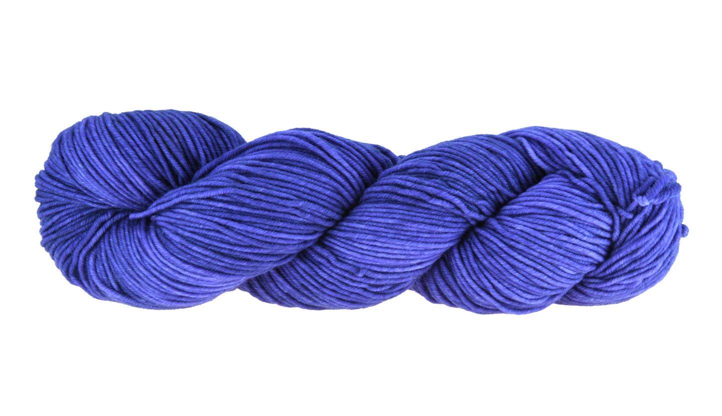 A twisted skein of Barn Yarn DK weight yarn in colorway Lavender; inspired by the lavender flower, perfect for knitting and crochet projects.