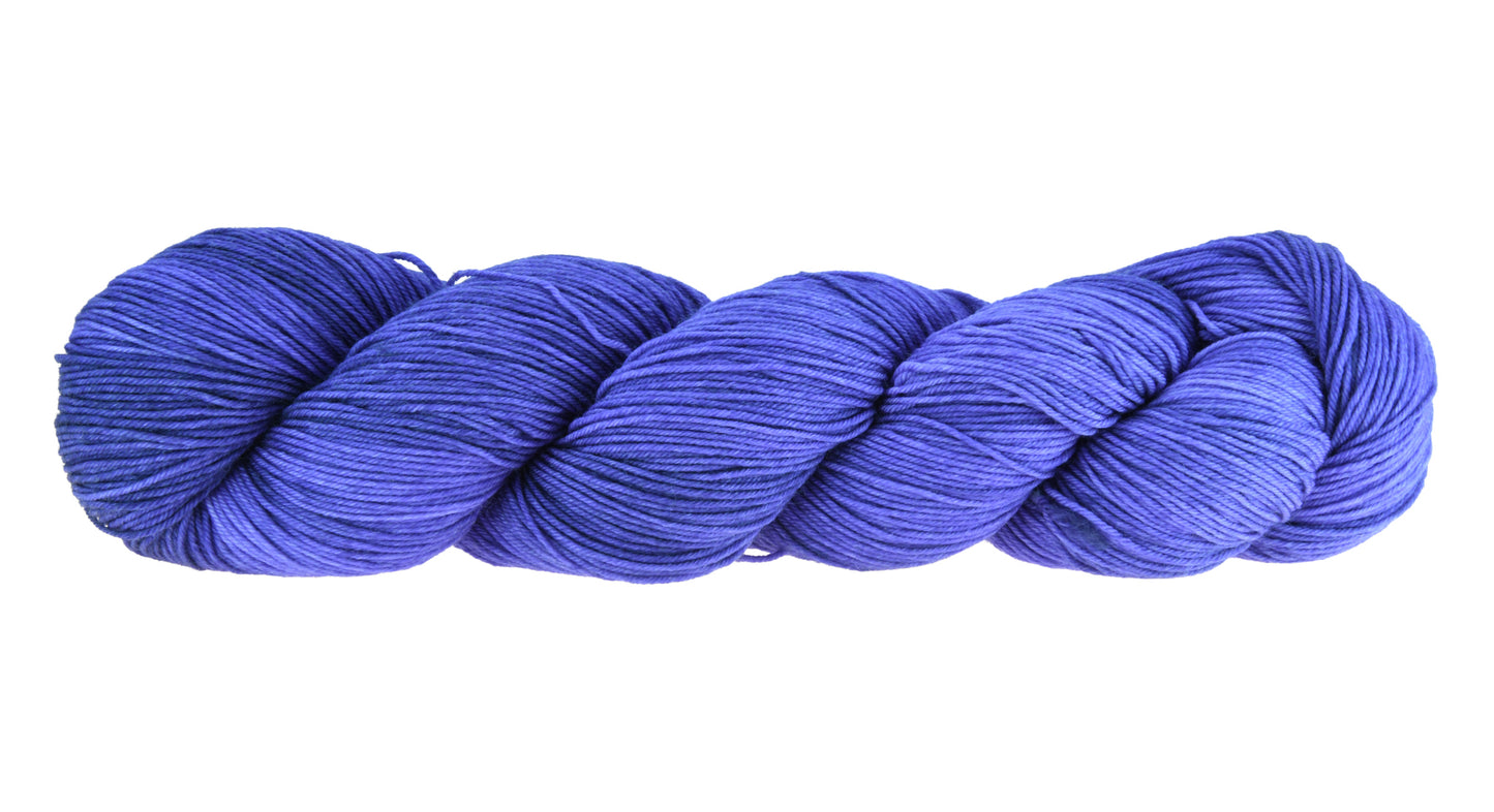 A twisted skein of Barn Yarn fingering weight yarn in colorway Lavender; inspired by the lavender flower, perfect for knitting and crochet projects.