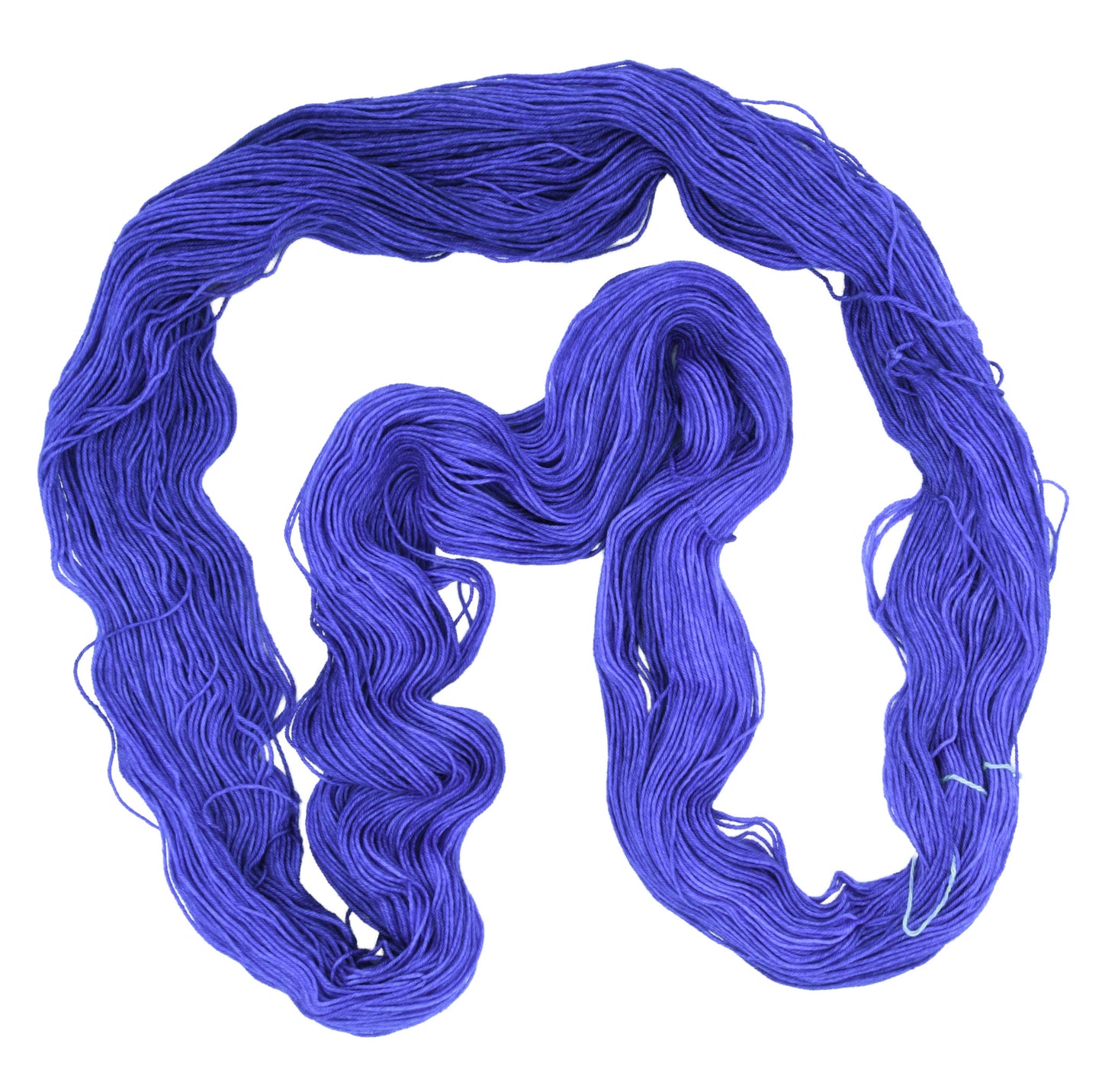 An unfolded skein of Barn Yarn fingering weight yarn in colorway Lavender; inspired by the lavender flower, perfect for knitting and crochet projects.