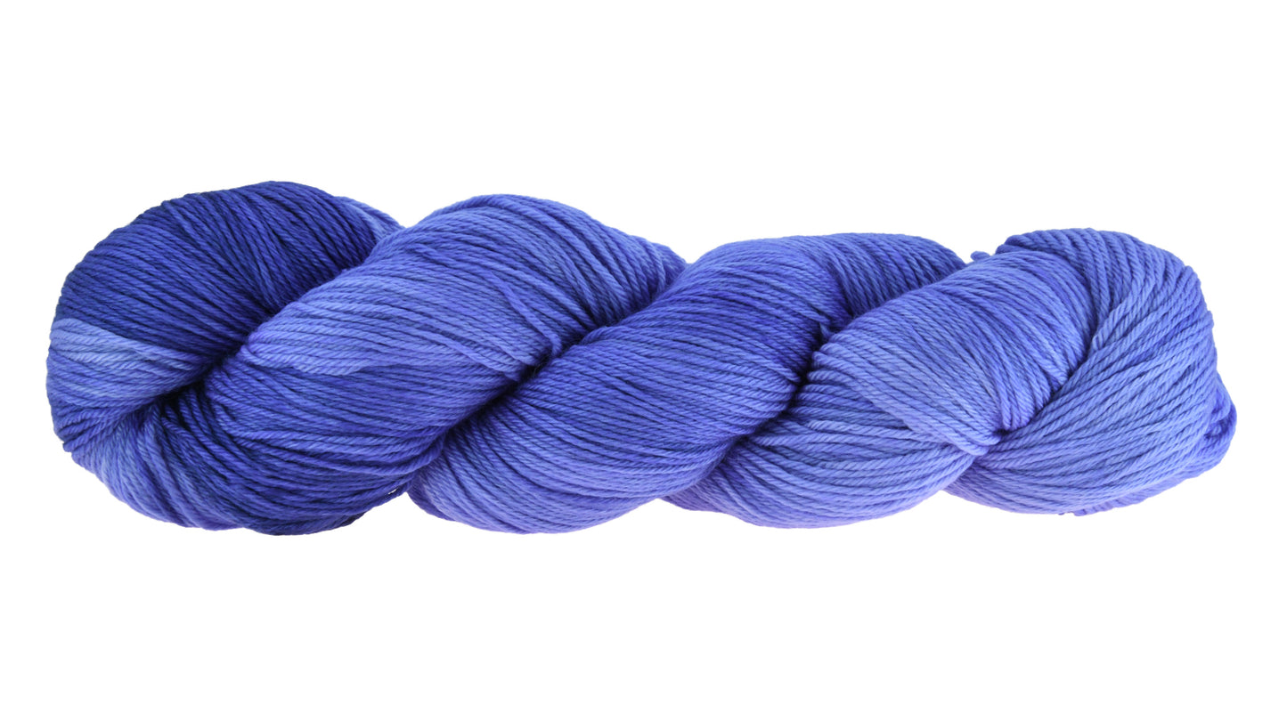 A twisted skein of Barn Yarn merino-cashmere-nylon fingering weight yarn in colorway Lavender; inspired by the lavender flower, perfect for knitting and crochet projects.