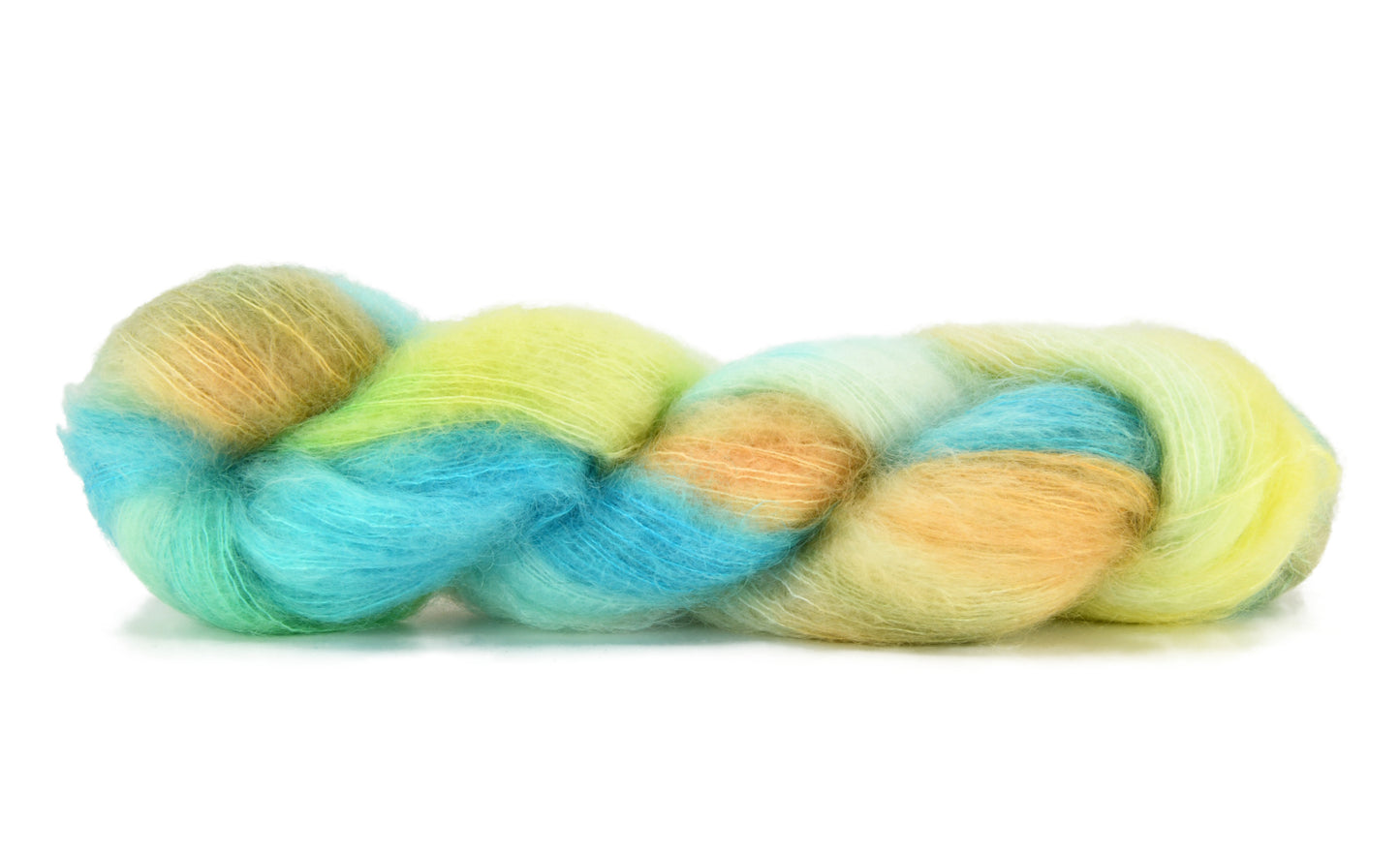 A twisted skein of Barn Yarn hand-dyed mohair yarn in colorway Down by the Seaside with breezy blues, sandy neutrals, and sea-glass greens, perfect knitting and crochet.