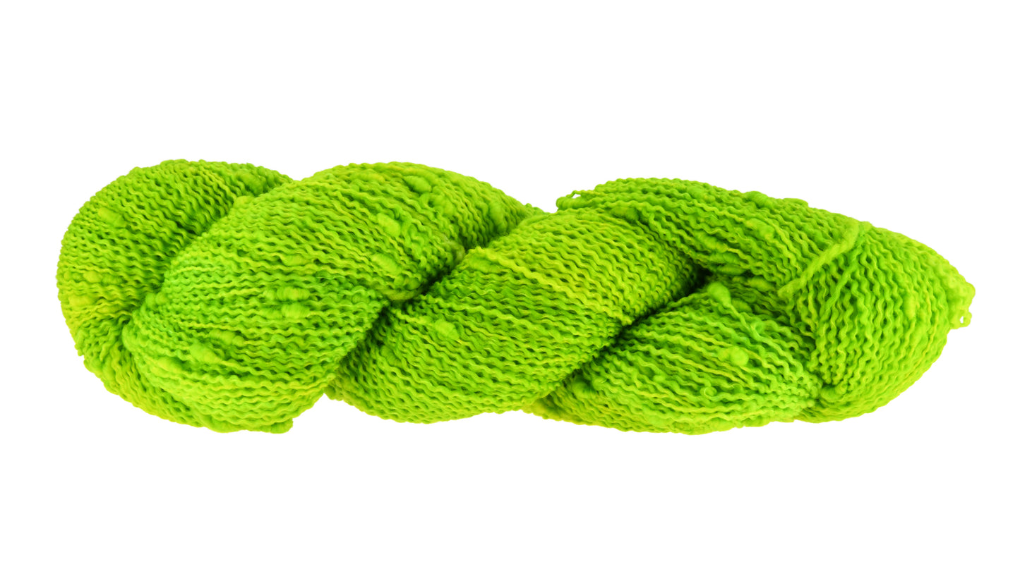 A twisted skein of Barn Yarn hand-dyed slub yarn in colorway Get in Lime - a bold lime green shade, perfect for playful knitting and crochet projects.