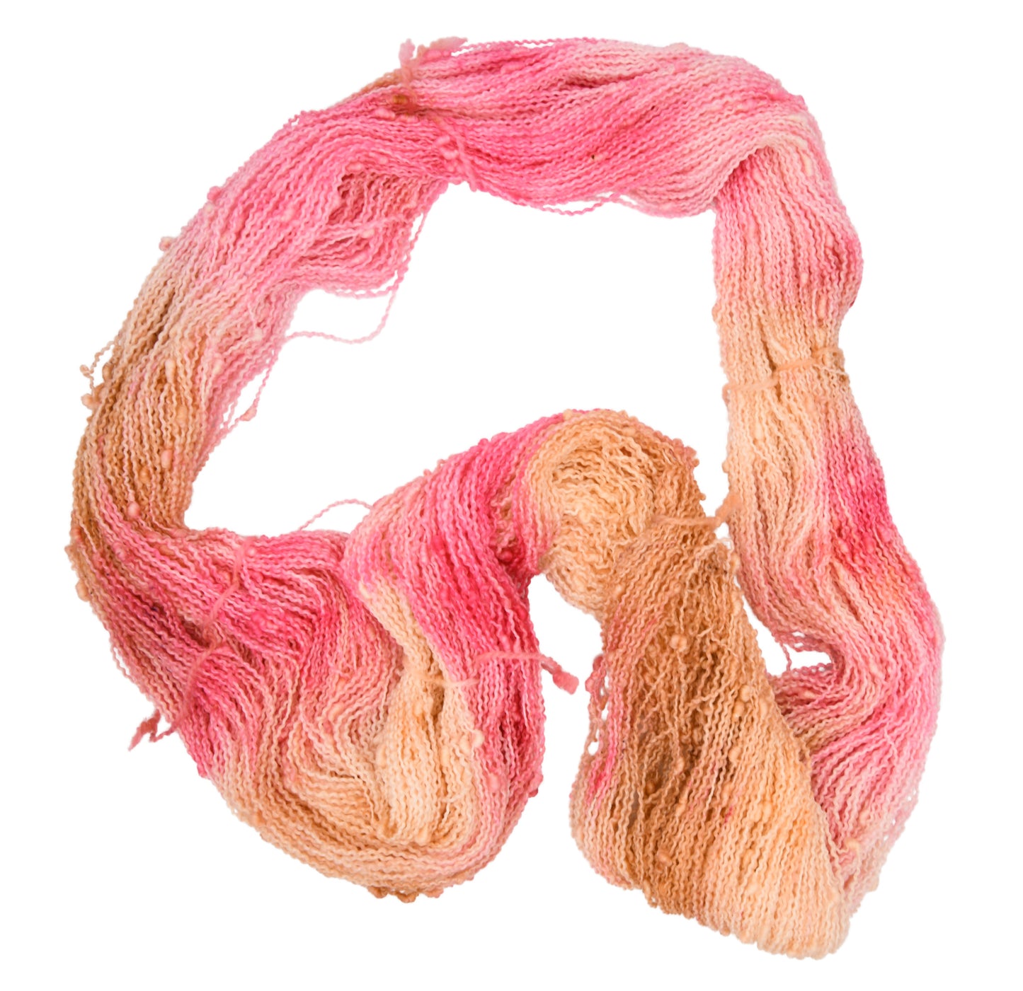An unfolded skein of Barn Yarn hand-dyed slub yarn in colorway Poolside Popsicle featuring bright strawberry pink, vanilla and chocolate sprinkles, perfect for knitting and crochet projects.
