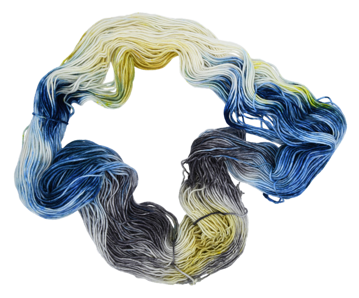 An unfolded skein of Barn Yarn hand-dyed sport weight yarn in colorway Beehive featuring golden yellow, soft gray and blue tones, perfect for warm and vibrant knitting and crochet projects.
