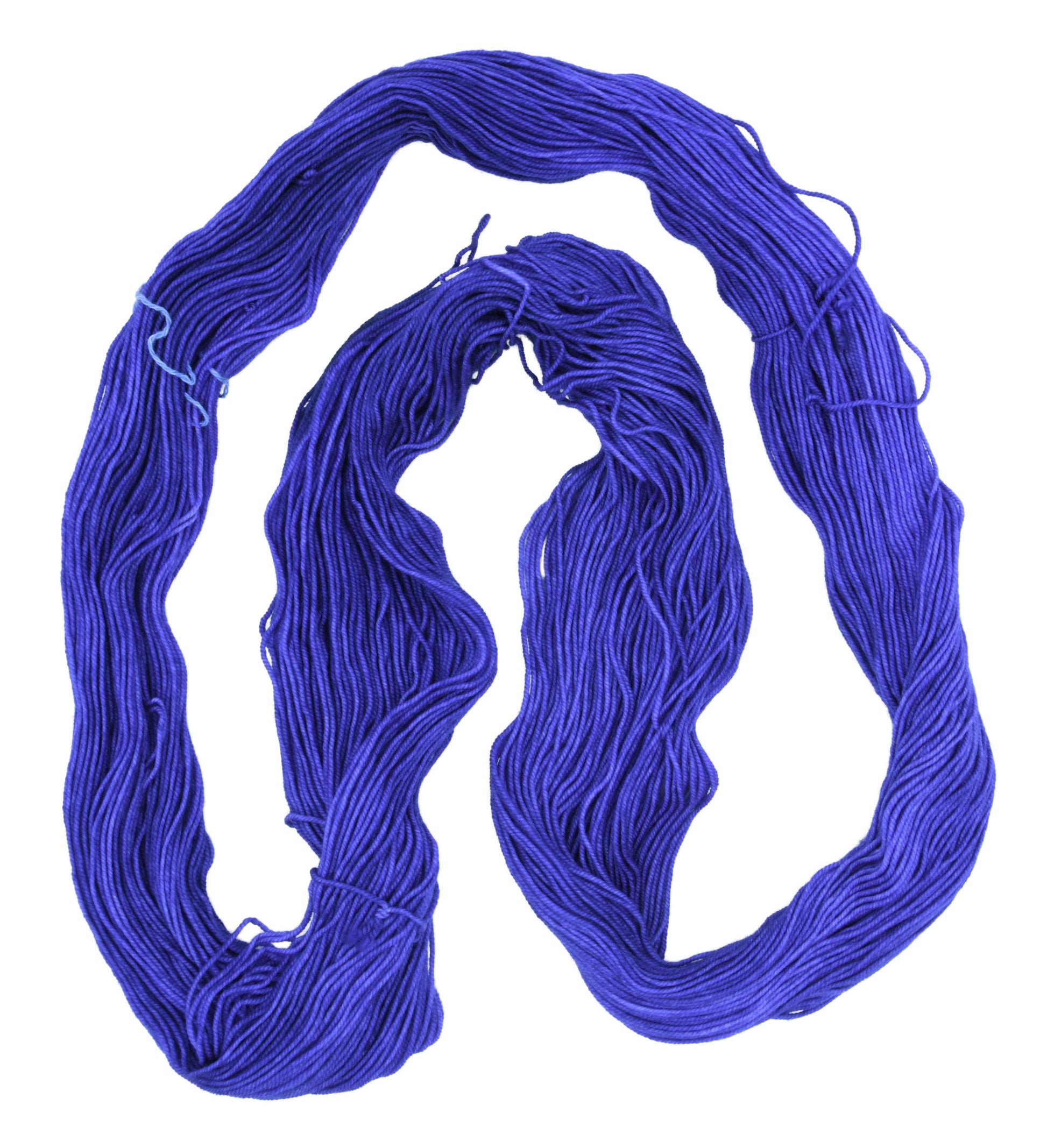 An unfolded skein of Barn Yarn sport weight yarn in colorway Lavender; inspired by the lavender flower, perfect for  knitting and crochet projects.