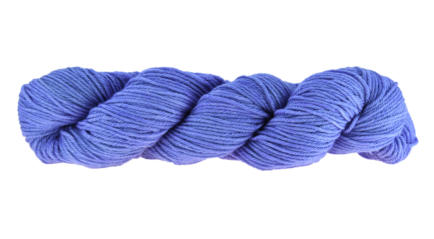 A twisted skein of Barn Yarn worsted weight yarn in colorway Lavender; inspired by the lavender flower, perfect for knitting and crochet projects.