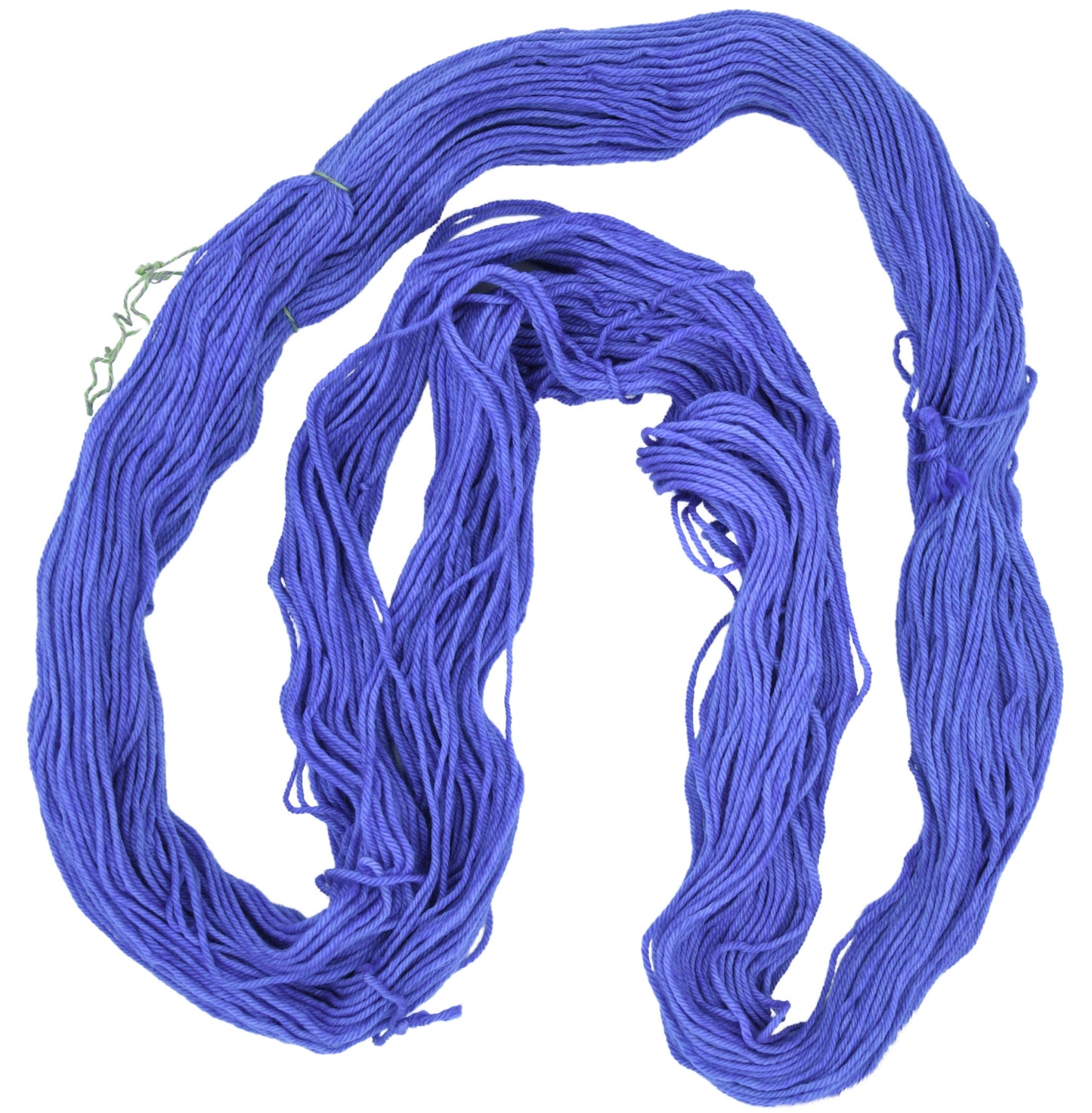 An unfolded skein of Barn Yarn worsted weight yarn in colorway Lavender; inspired by the lavender flower, perfect for knitting and crochet projects.