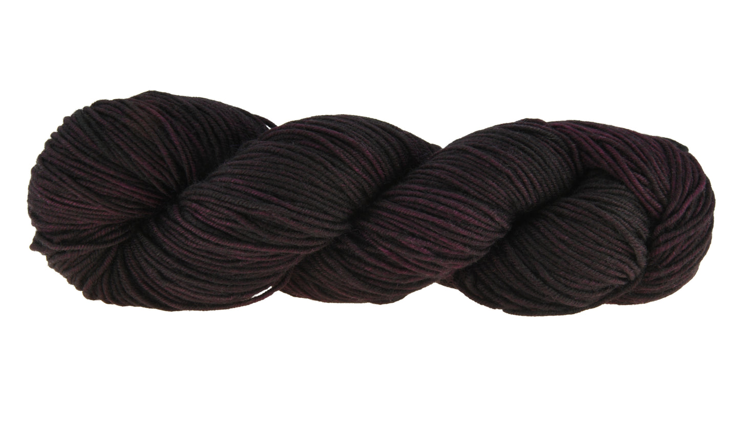Barn Yarn twisted skein of Shiraz DK weight hand-dyed yarn in a deep, dark burgundy, ideal for knitting and crochet projects needing rich, wine-inspired color.