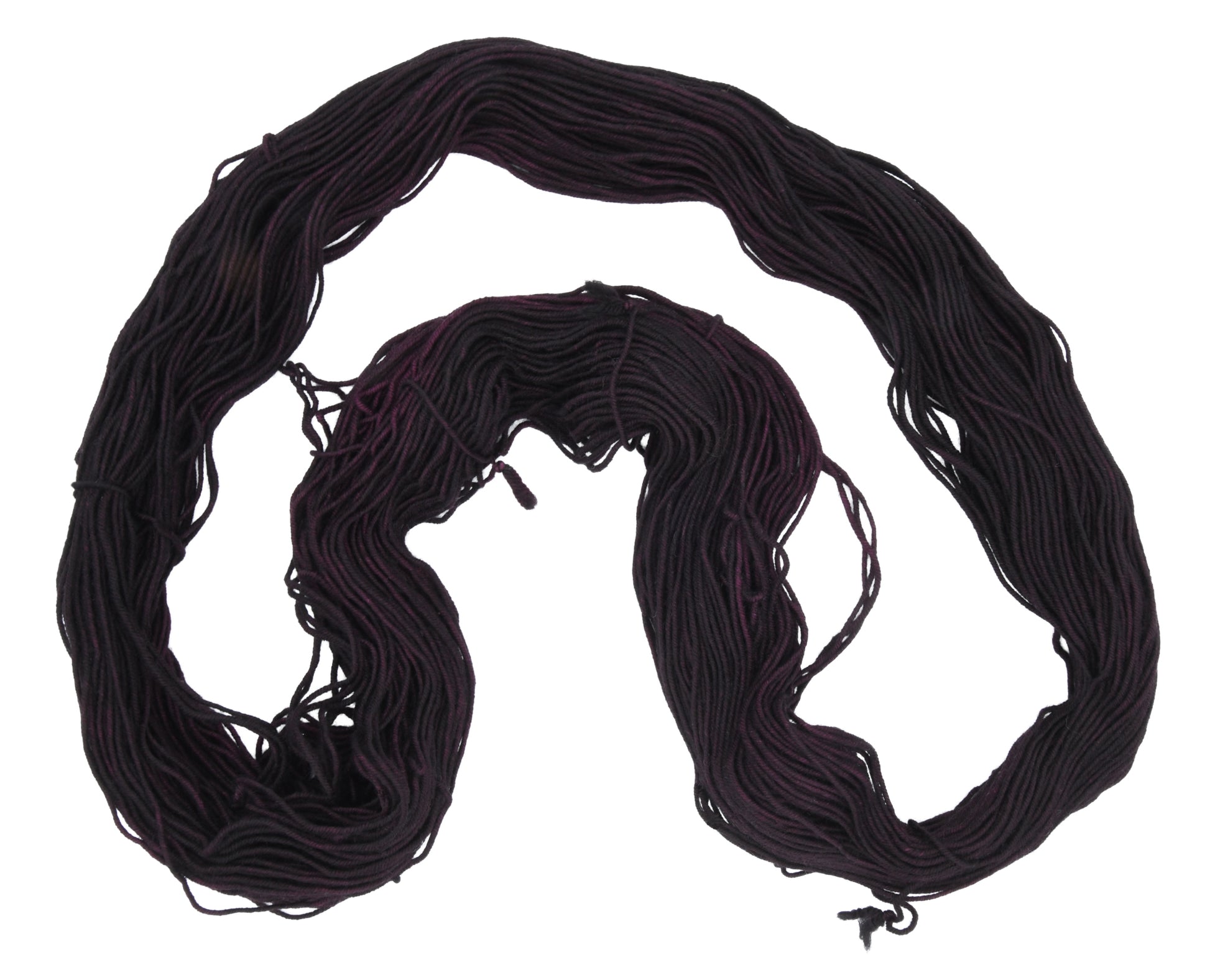 Barn Yarn unfolded skein of Shiraz sport weight hand-dyed yarn in a deep, dark burgundy, ideal for knitting and crochet projects needing rich, wine-inspired color.