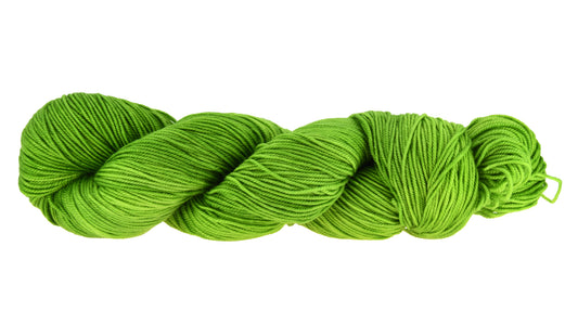 A twisted skein of Barn Yarn hand-dyed sport weight yarn in colorway Envy - a vibrant avocado green shade, perfect for bold knitting and crochet projects.