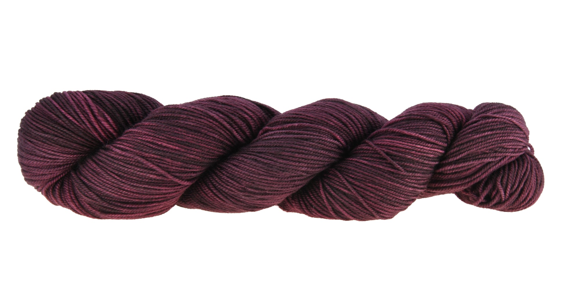 A twisted skein of Barn Yarn hand-dyed sport weight yarn in colorway Plum; a rich, deep purple shade, perfect for sophisticated knitting and crochet projects.