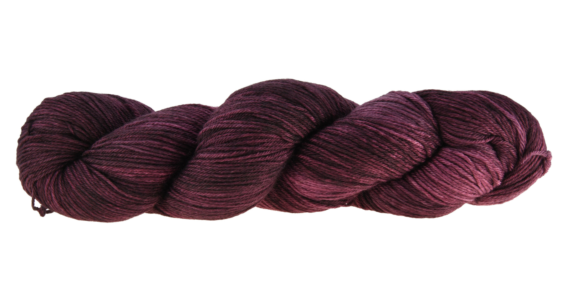 A twisted skein of Barn Yarn hand-dyed merino-cashmere-nyon blend yarn in colorway Plum; a rich, deep purple shade, perfect for sophisticated knitting and crochet projects.