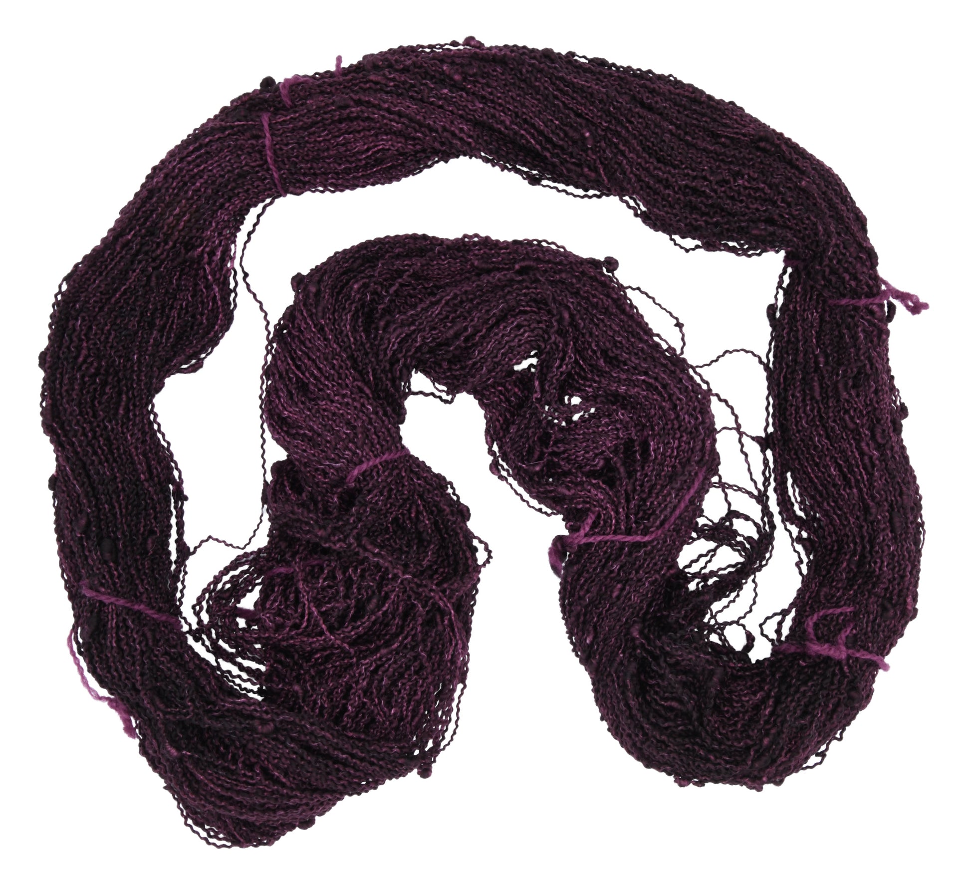 An unfolded skein of Barn Yarn hand-dyed slub yarn in colorway Plum; a rich, deep purple shade, perfect for sophisticated knitting and crochet projects.