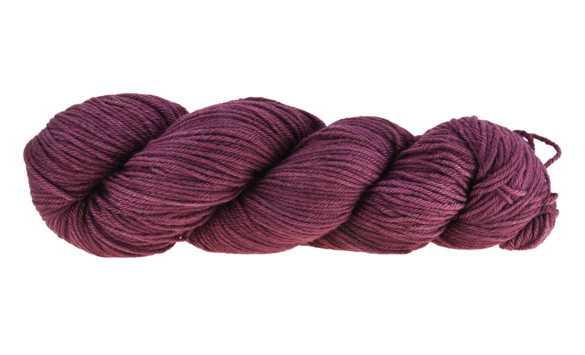 A twisted skein of Barn Yarn hand-dyed worsted weight yarn in colorway Plum; a rich, deep purple shade, perfect for sophisticated knitting and crochet projects.